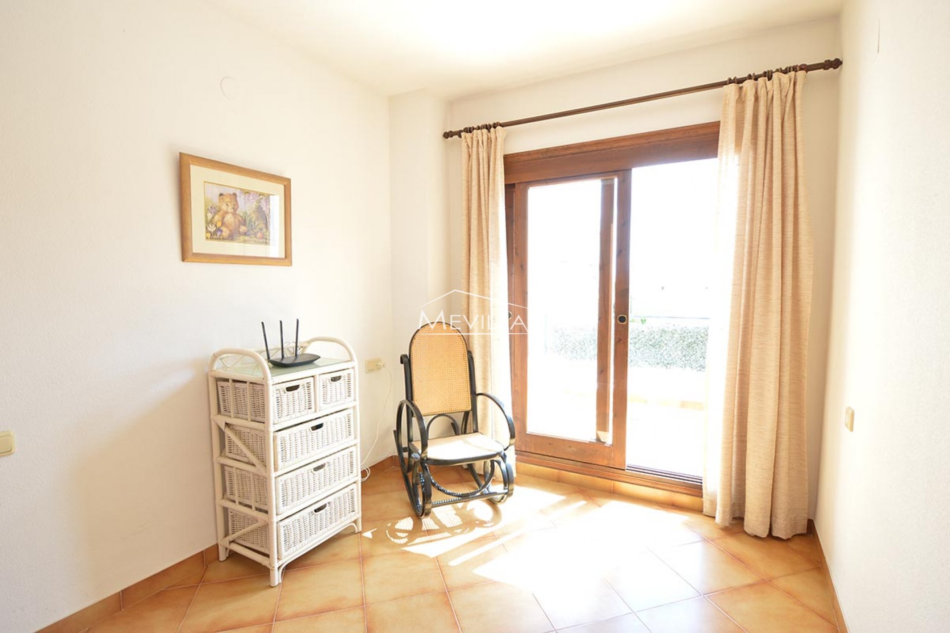 The bedroom with access to the terrace on the first floor